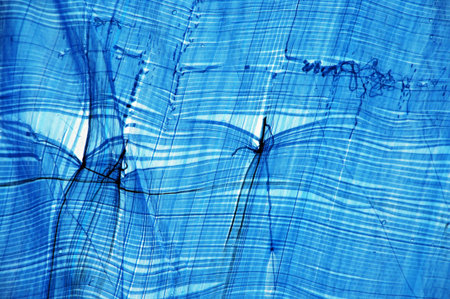 abstract blue background with some smooth lines in it and some reflectionsの写真素材