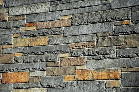 Background of stone wall texture. Architectural detail. Toned.