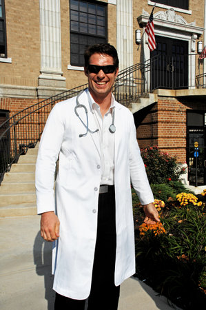 A man in a white coat and a stethoscope around his neck.のeditorial素材