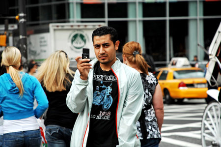 Fashionable man poses outside Gucci fashion show building during Milan Women's Fashion Week in Milan.のeditorial素材