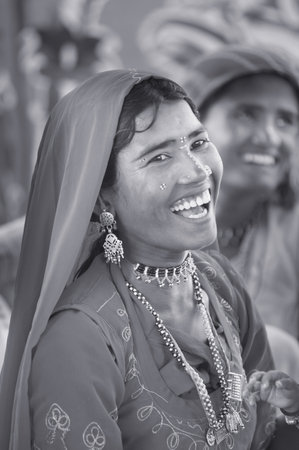 Portrait of a smiling Indian woman wearing sari on the streets of Mumbaiのeditorial素材