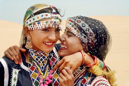 Two young women in the desert of Dubai, United Arab Emirates.のeditorial素材