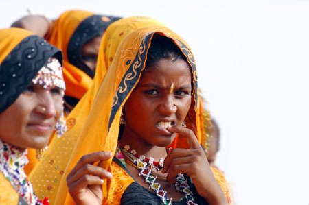 A group of Hindu women in yellow saris in Kolkata, India.のeditorial素材