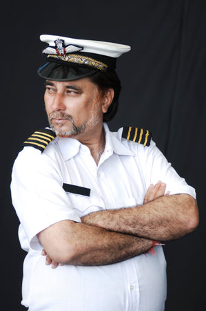 Portrait of a man in the form of a pilot on a black background