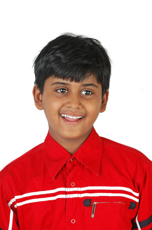 A portrait of a young Indian boy in a red shirt on a white background.のeditorial素材