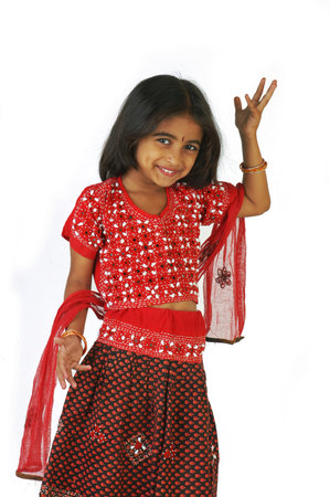 A young Indian girl wearing a red sari on white background.のeditorial素材
