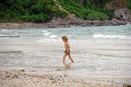 Little boy playing on the beach, Koh Samui, Thailand.のeditorial素材