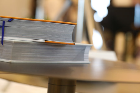Books on a table in a cafe. Selective focus, shallow depth of field.