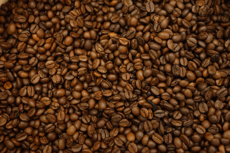 Roasted coffee beans background. Close up of coffee beans texture.