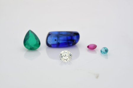 jewelry and precious stones on a white background, closeup of photo