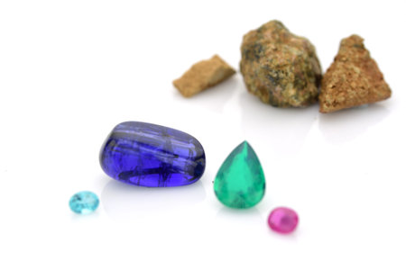 blue and green sapphire gemstones isolated on white background.の写真素材