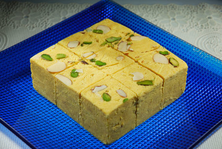 Indian Traditional Sweets, Halwa or Halwa made using sweet condensed Milk and spices, garnished with...