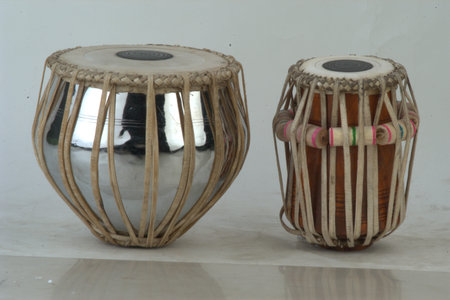 Two wooden djembe drums on a white background. Musical instruments.