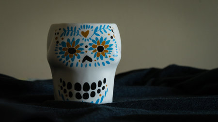 Ceramic cup on a dark background. Ukrainian folk art.