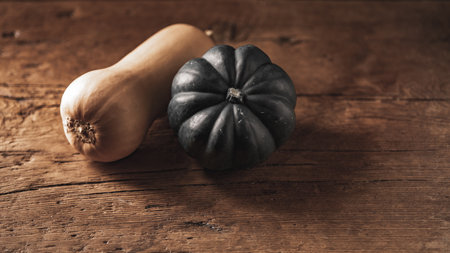 Pumpkin and squash on a wooden background. Toned.