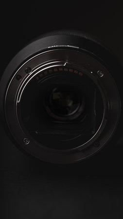 Camera lens on a black background. Close-up of a camera lens.