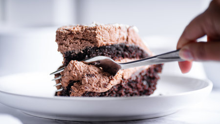 Chocolate cake with ice cream on a white plate, selective focus