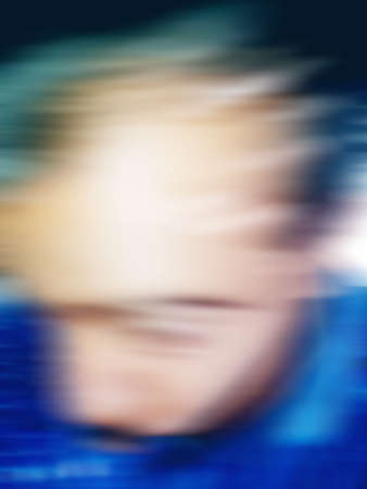 An Indian or asian guy showing his funny facial expression to the camera. Blurred or defocused image.の写真素材