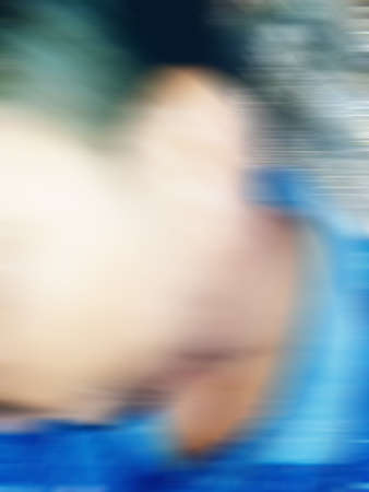 An Indian or asian guy showing his funny facial expression to the camera. Blurred or defocused image.の写真素材