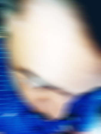 An Indian or asian guy showing his funny facial expression to the camera. Blurred or defocused image.の写真素材