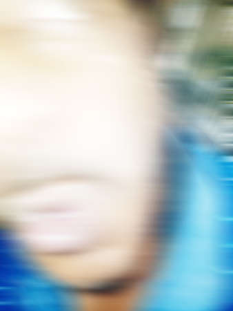 An Indian or asian guy showing his funny facial expression to the camera. Blurred or defocused image.の写真素材