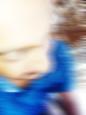 An Indian or asian man showing his funny facial expression to the camera. Defocused or blurred image.の写真素材