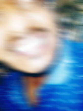 An Indian or asian guy showing his funny facial expression to the camera. Blurred or defocused image.の写真素材