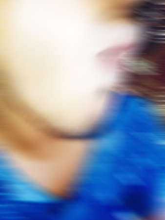 An Indian or asian guy showing his funny facial expression to the camera. Blurred or defocused image.の写真素材