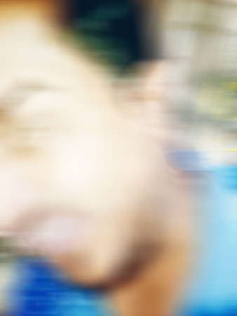 An Indian or asian guy showing his funny facial expression to the camera. Blurred or defocused image.の写真素材