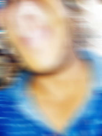 An Indian or asian guy showing his funny facial expression to the camera. Blurred or defocused image.の写真素材