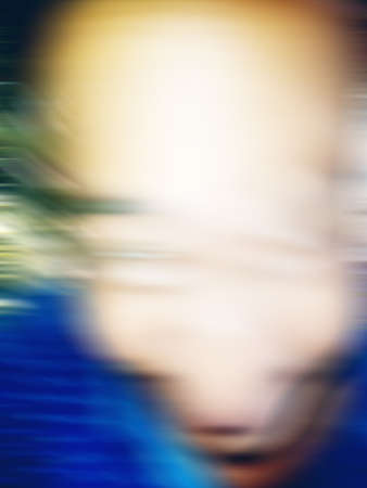An Indian or asian guy showing his funny facial expression to the camera. Blurred or defocused image.の写真素材