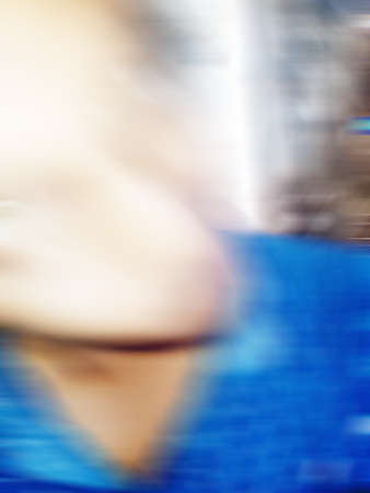 An Indian or asian guy showing his funny facial expression to the camera. Blurred or defocused image.の写真素材