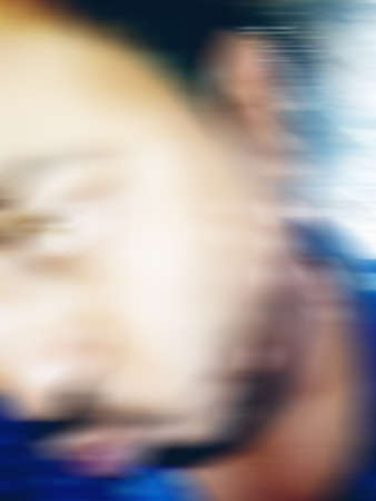 An Indian or asian guy showing his funny facial expression to the camera. Blurred or defocused image.の写真素材