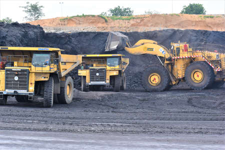 Ajmer, India - July 1, 2020 : Huge Dumper Earth mover Truck carrying minerals at an open pit quarry...