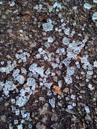 The Broken glass pieces on the road