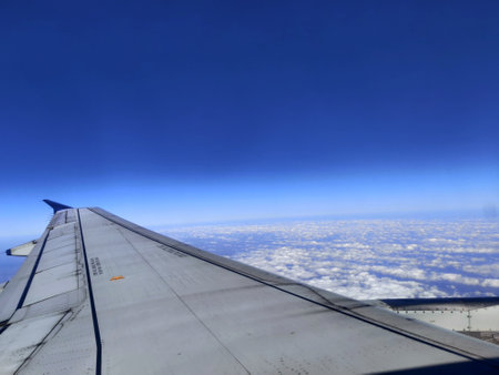 View of airplane wing from airplane windowの写真素材