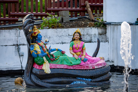 Statue of lord Vishnu and Goddess Laxmi at the sacred lake of Grand Bassin, Ganga Talao in the south of the republic of Mauritius.の写真素材