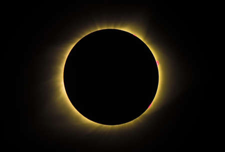Solar Eclipse engulfed in a shadow cast by the Moonの写真素材