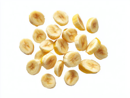 A vibrant display of fresh banana slices, neatly arranged. The yellow fruit pieces offer a healthy and delicious treat, perfect for showcasing natural food and dietary concepts.の素材