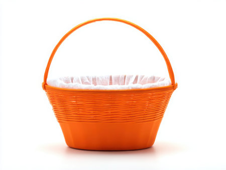 A vibrant orange woven basket with a white liner is centered on a clean white backdrop. The basket's design and color make it ideal for spring holidays or decorative arrangements.の素材