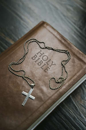 a cross chain kept on the holy Bibleの写真素材