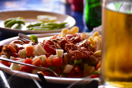 Chicken dish with saladの写真素材