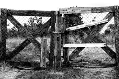 Old entrance gate to the fruit orchard on the outskirts of the cityの写真素材