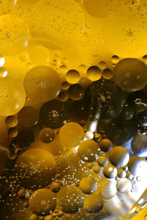 Bubbles from oil in water - macro photoの写真素材