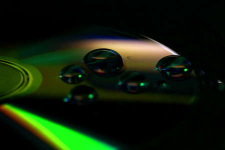 Water drops on DVD in macro photographyの写真素材