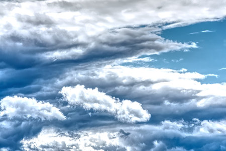 Swirling clouds against the blue sky