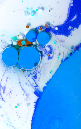 abstract blue and white background with oil drops on the water surfaceの写真素材