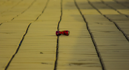 a watse can is lieing on the floorの写真素材