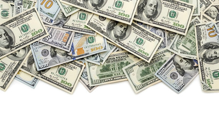 A chaotic pile of scattered US one hundred dollar bills in various orientations and overlapping.