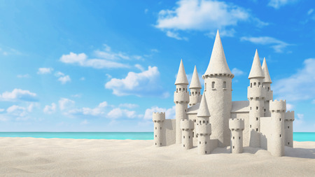 Sandcastle beach on bright blue sky backgroundの写真素材